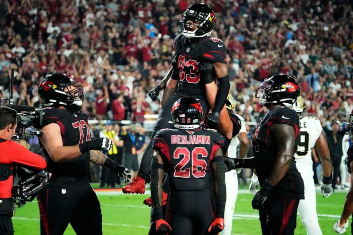 #83 Greg Dortch is lifted up into the air by his teammates after his second career touchdown